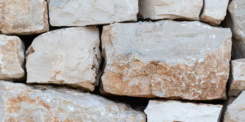 A picture of stacking boulders cut with straight sides so they lay flat on top of each other.