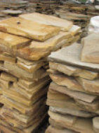 A picture of a stack of thin veneer flagstone.