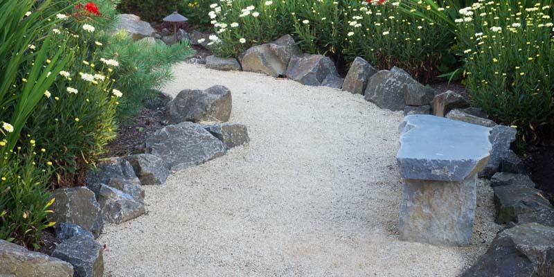 A picture of a gravel walkway and landscaping in Atlanta, GA.